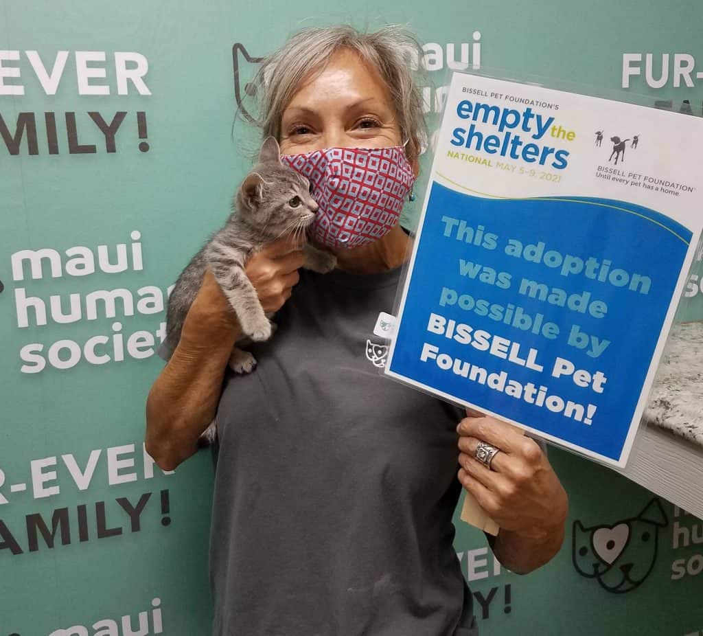 Empty-the-Shelters-12-1-1024x926 Person adopting kitten with Empty the Shelters Sign